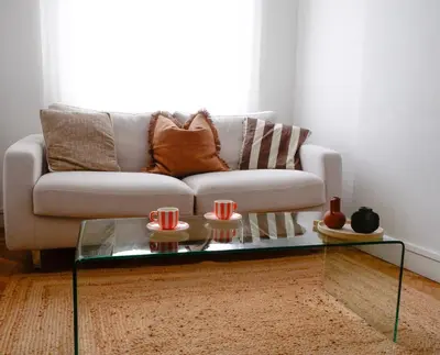 a living room with a couch and a glass coffee table at Ker Riviera in Nice