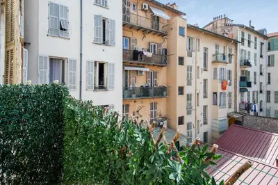 a view from a balcony of buildings at Appartement Pertinax - Welkeys in Nice