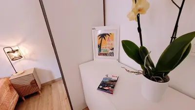 a white refrigerator with a plant on a table at Ze Perfect Place - Confortable appartement 2 CHB - Asc - Port - Garibaldi in Nice