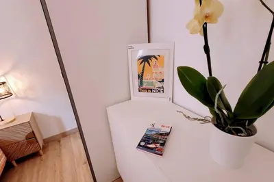 a white refrigerator with a picture and a plant on it at Ze Perfect Place - Confortable appartement 2 CHB - Asc - Port - Garibaldi in Nice