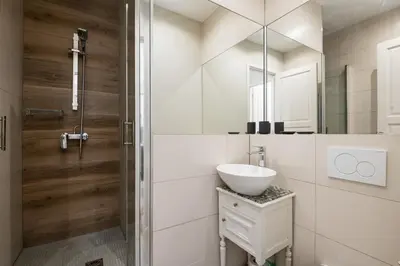 a white bathroom with a sink and a shower at 