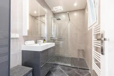 a bathroom with a sink and a shower at Sea View Large 2 Bdr Promenade des Anglais in Nice