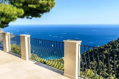 a balcony with a view of the ocean at Sea View Apartment with Private Secure Parking 1 in Villefranche-sur-Mer