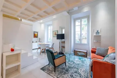 a living room with a couch and a table at Happyfew Liberty in Nice