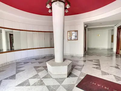 a room with a column and a red ceiling at Nestor&Jeeves - ANDRIOLI TERRASSE - Central - Close beach - Top floor in Nice