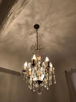 a chandelier hanging from a ceiling at Petit Palace in Old Nice in Nice