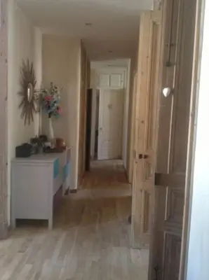 an empty room with a hallway with a table and a hallwayngthngthngthngth at Great and light private room in the heart of Nice in Nice