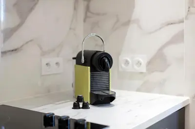 a camera sitting on top of a counter in a bathroom at Maison Bianchi - Villefranche in Villefranche-sur-Mer