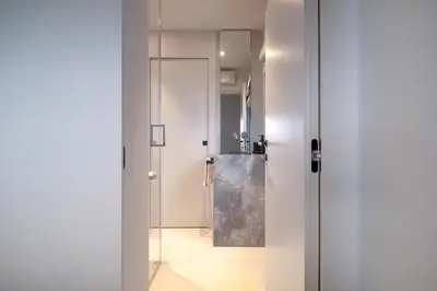 a bathroom with a glass door and a sink at Villa Vista Mare by iVillamia com in Villefranche-sur-Mer