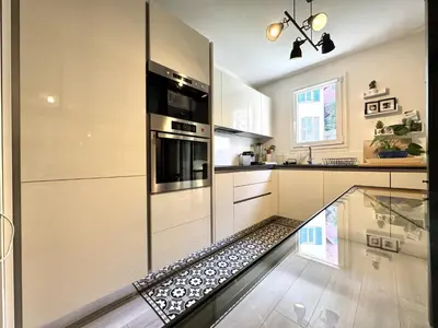a kitchen with a glass floor in the middle at ApartHotel Riviera - Terrasse Loft de la Providence - Vieille Ville - Esprit Loft en 2 pices AC in Nice