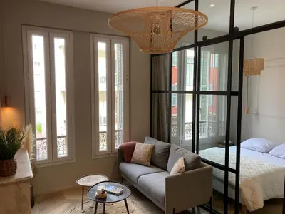 a living room with a bed and a couch at A & K luxury appartments Port de Nice Garibaldi in Nice