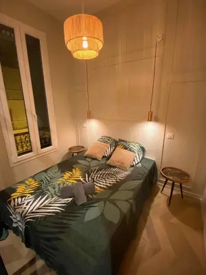 a bedroom with a large bed with pillows on it at A & K luxury appartments Port de Nice Garibaldi in Nice