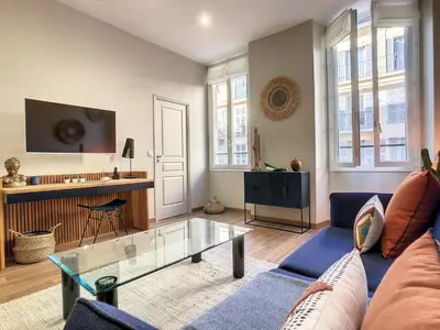 a living room with a couch and a table at Nestor&Jeeves - CACTUS RIVIERA - Hyper center - Very close sea and Place Massena in Nice