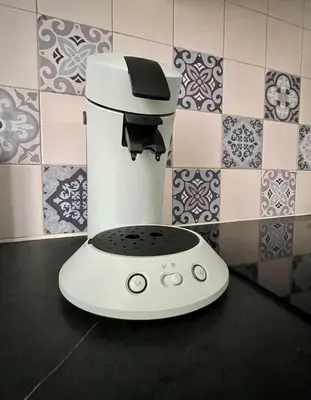 a white blender sitting on a counter in a kitchen at Joli appartement spacieux à 3 min à pied de la mer in Nice