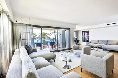 a living room with a couch and chairs and a table at Sublime Appartement Promenade des Anglais (3) in Nice