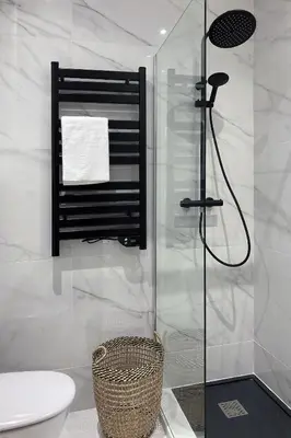 a bathroom with a shower with a toilet and a sink at Superbe studio Plage/ Promenade des Anglais 102 in Nice