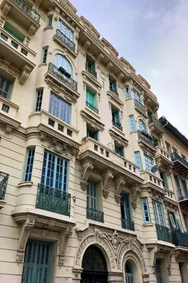 a large building with windows and balconies on it at Superbe studio Plage/ Promenade des Anglais 102 in Nice