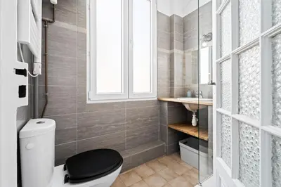 a bathroom with a shower with a sink and a toilet at Nice Renting - NOTRE DAME - Cosy Loft Perfect View on the roofs in Nice