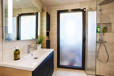 a bathroom with a sink and a shower at Villa Les Sources VI4245 By Riviera Holiday Homes in Nice