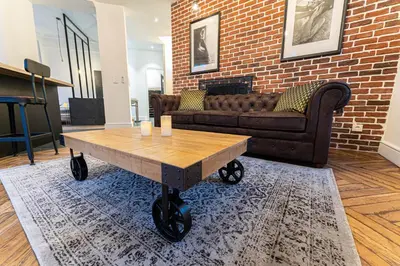 a living room with a couch and a coffee table at Jacuzzi-Nice quartier des musiciens-Loft in Nice