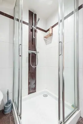 a shower with a glass door in a bathroom at Atypical Cozy 1 Bdr Old Town in Nice