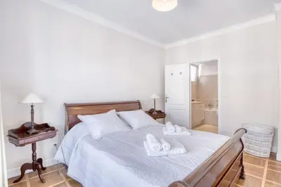 a bedroom with a bed with two towels on it at Horizon Blue Lux Apartment in Nice