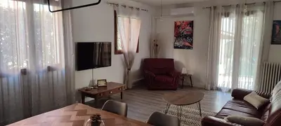 a living room with a couch and a chair at LA CASA in Cagnes-sur-Mer
