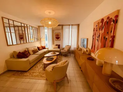 a living room with a couch and a table at Nice Renting - PAGANINI - Spacious Apartment - 2 BedRooms - King Bed - Bathtub - Heart of Nice in Nice