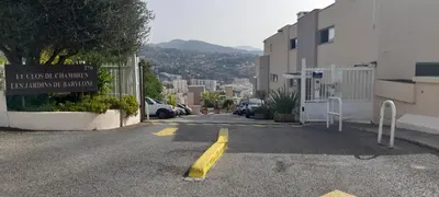 a street with a sign on the side of a building at Chambre d hôte avec clim terrasse et petit déjeuner Hauteurs de Nice in Nice
