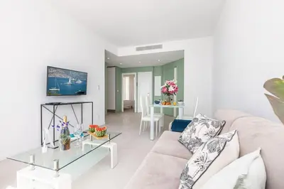 a living room with a couch and a glass table at MY CASA - PROM 163 - 2 rooms with terrace Promenade des Anglais in Nice
