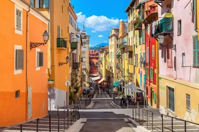 an alley in the city with buildings at LA LANTERNE in Nice
