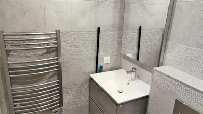 a bathroom with a sink and a mirror at hypercentre lamartine 001 in Nice