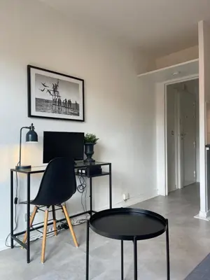 a room with a desk with a computer and two chairs at Nice Promenade 2 in Nice