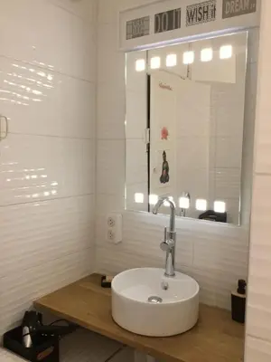 a bathroom with a sink and a mirror at Studio Bel Air FSHH in Nice