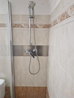 a shower with a hose in a bathroom at Le Cosy - Place Masséna in Nice