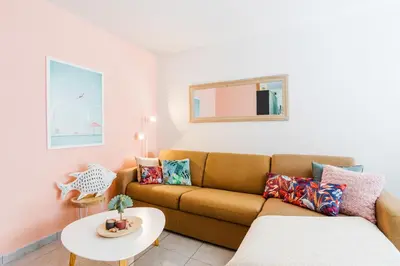 a living room with a couch and a table at PALAIS LIBERTE V AP4267 By Riviera Holiday Homes in Nice