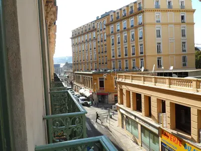 a view of a city street from a balcony at Appartement du Thiers in Nice