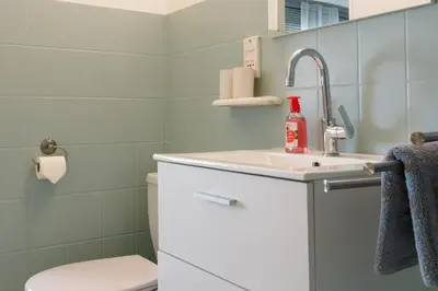 a bathroom with a sink and a toilet at Apart Nissa Bella Centre / Promenade des Anglais in Nice