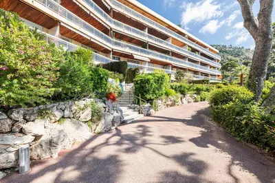 a building with a path in front of a building at Extraordinary Sea View - 1 Bdr with AC in Villefranche-sur-Mer