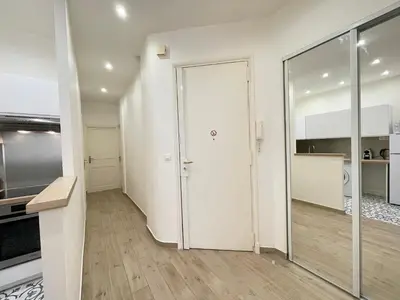 a hallway with a sliding door in a kitchen at Nice Renting - Penchienatti - Spacious Apartment - 2 BedRooms - King Bed - View Heart of Nice in Nice