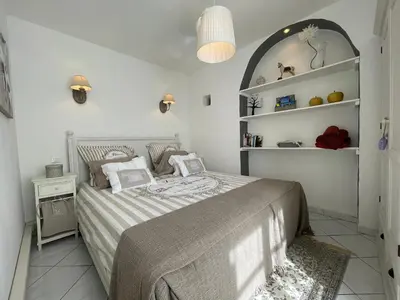 a bedroom with a bed and a shelf at Nice Renting - 9 MASSENA - Spacious apartment Massena Square - AC - fully equipped in Nice