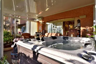 a large bath tub in the middle of a house at Harmonice in Cantaron