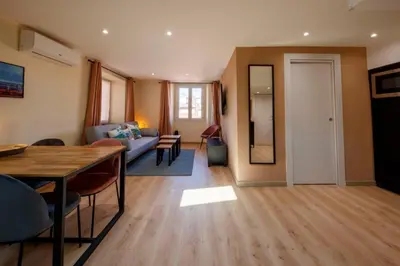 a living room with a table and a couch at 06A2 - Heart of Old Nice beautiful renovated apartment in Nice