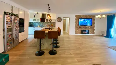 a kitchen with a table and chairs in a room at Villa Canarias in Saint-Jeannet