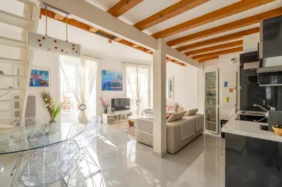 a living room with a glass table and a couch at Stunning Duplex place Masséna 2 mins walk from beaches in Nice