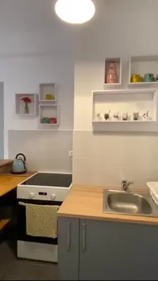 a kitchen with a sink and a stove at Appartement entier. Nice Riquier in Nice
