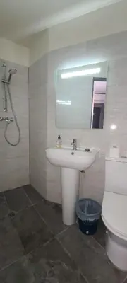 a bathroom with a sink and a toilet and a mirror at ESPERANCE HOTEL in Nice