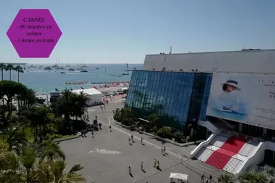 a crowd of people walking on a beach near the ocean at Studio - 1 minute de la plage et de la Promenade des Anglais in Nice