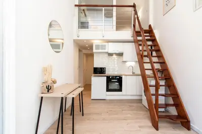a small kitchen and staircase in a tiny apartment at Maison Bianchi - Prefecture - Old Town in Nice
