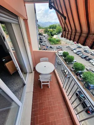 a balcony with a view of a parking lot at Appartement F3 traversant avec 2 terrasses et parking in Cagnes-sur-Mer